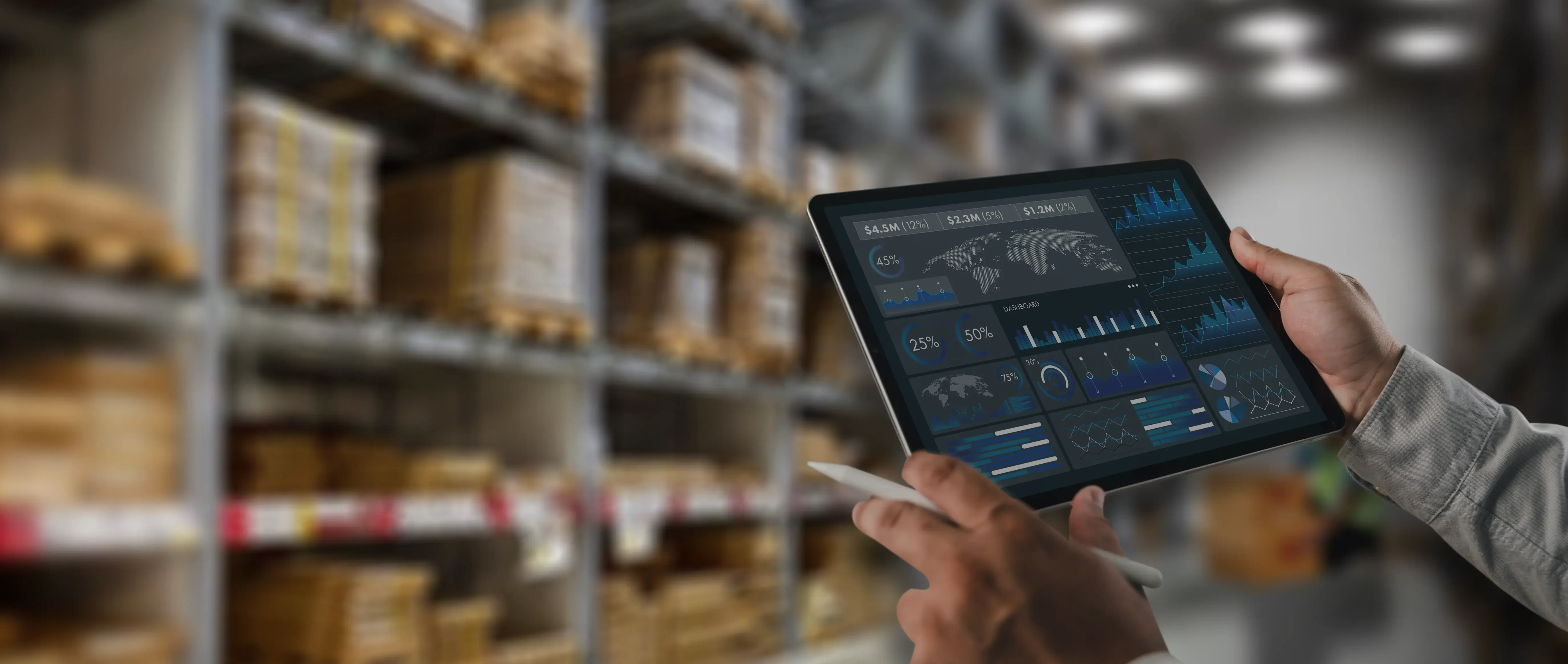 Person holds tablet displaying 'GLOBAL SUPPLY CHAIN' data against a warehouse backdrop.