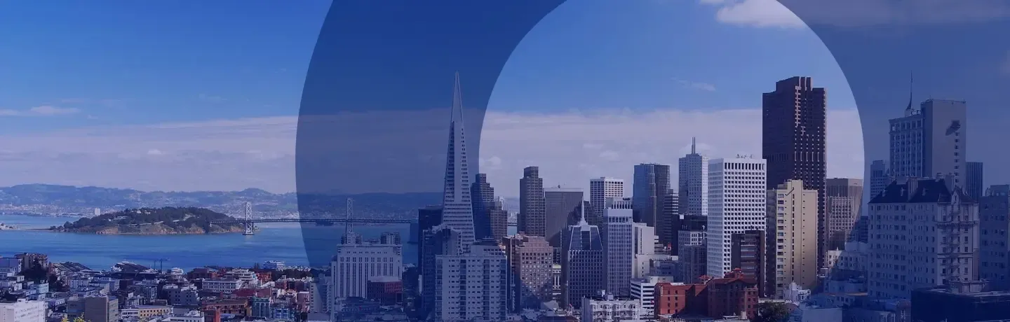 San Francisco skyline, Alcatraz Island, and Golden Gate Bridge with a blue translucent overlay.