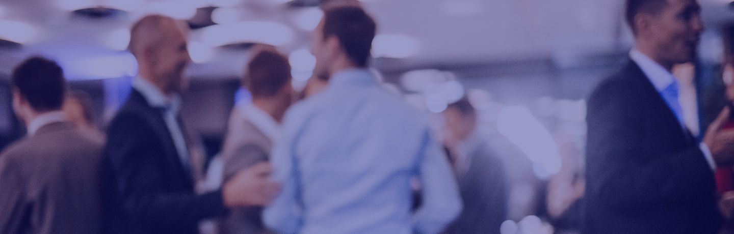 Group of business professionals networking at a corporate event.