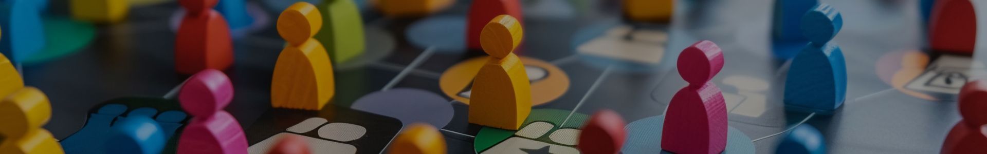 Colorful, abstract figures resembling game pieces in a vibrant, artistic display.