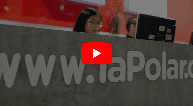YouTube play button over blurred background featuring website text 'www.laPolar.c' and two people.